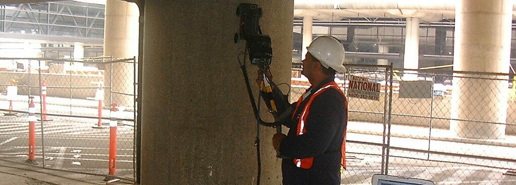 Technician Performing Subsurface Interface Radar on a Pillar in a Parking Deck