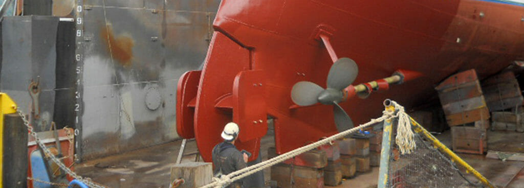 Technician Performing Visual Assessment of Vessel's Stern