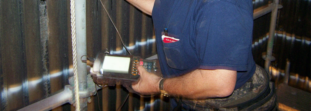 Technician Checking Thickness of Piping Section Using Ultrasonic Testing